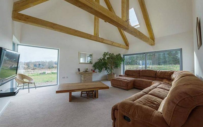 Luxury eco new build in Tarlogie Tain, with a 3 bay larch clad garage, wood burner & solar heating